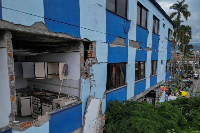 An aerial view shows a building with structural damage in Pereira, Colombia, on August 15, 2026, days after a 7.4 earthquake. At least 287 people have died, thousands have been injured and about 379 remain unaccounted for, while the chances of finding earthquake survivors have dropped sharply since the critical 72-hour window passed. (Photo by Luis ACOSTA / AFP)