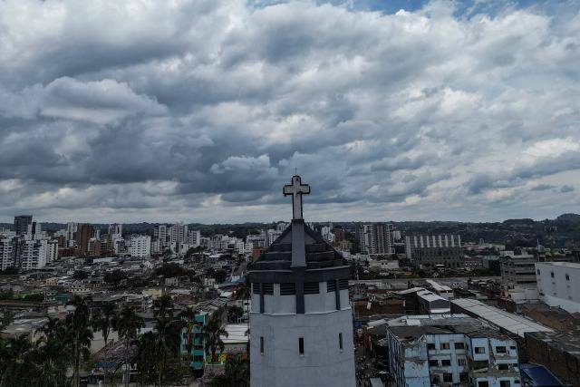 This aerial view shows La Valvanera Church with structural damage in Pereira, Colombia, on August 15, 2026, days after a 7.4 earthquake. At least 287 people have died, thousands have been injured and about 379 remain unaccounted for, while the chances of finding earthquake survivors have dropped sharply since the critical 72-hour window passed. (Photo by Luis ACOSTA / AFP)
