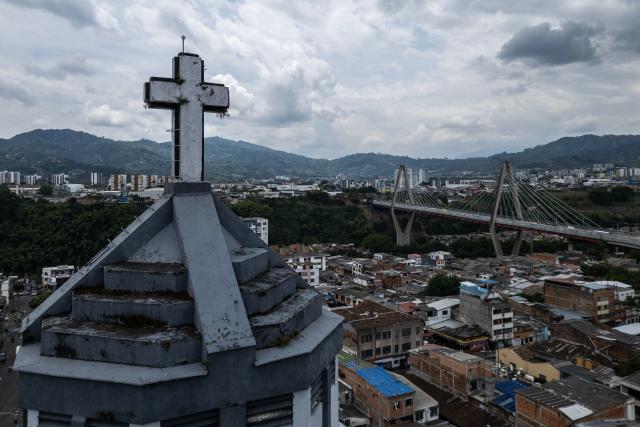 This aerial view shows La Valvanera Church with structural damage and the viaduct in the background in Pereira, Colombia, on August 15, 2026, days after a 7.4 earthquake. At least 287 people have died, thousands have been injured and about 379 remain unaccounted for, while the chances of finding earthquake survivors have dropped sharply since the critical 72-hour window passed. (Photo by Luis ACOSTA / AFP)