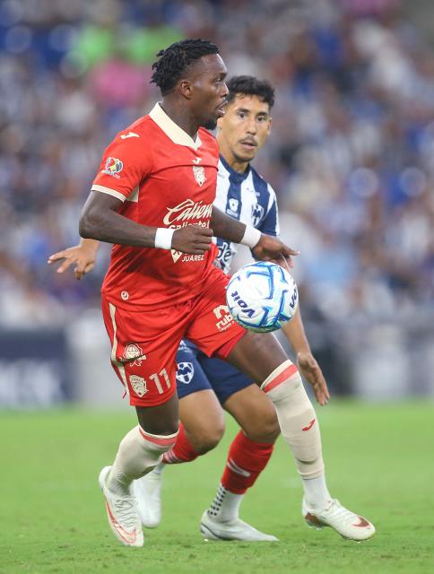 Juarez's Panamanian midfielder #11 Jose Rodriguez and Monterrey's defender #02 Ricardo Chavez fight for the ball during the Liga MX Apertura tournament football match between Monterrey and Juarez at BBVA stadium in Guadalupe, Nuevo Leon, Mexico on August 15, 2026. (Photo by Julio Cesar AGUILAR / AFP)