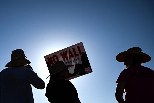People protest the plans by US President Donald Trump's administration to build a section of the border wall at the Big Bend National Park in Study Butte, Texas, on August 15, 2026. (Photo by RONALDO SCHEMIDT / AFP)