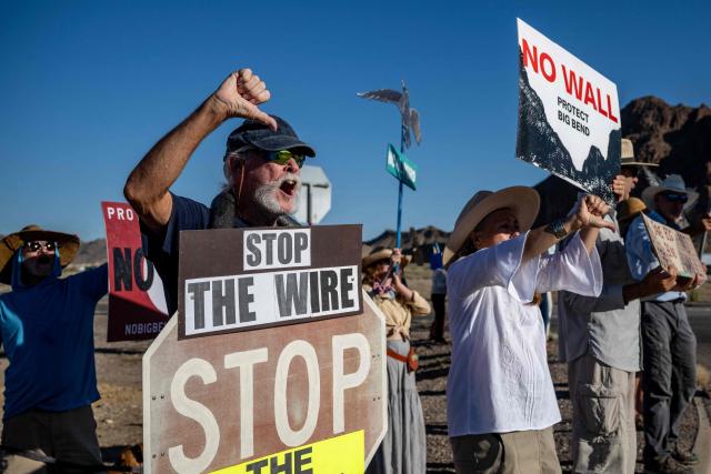 People protest the plans by US President Donald Trump's administration to build a section of the border wall at the Big Bend National Park in Study Butte, Texas, on August 15, 2026. (Photo by RONALDO SCHEMIDT / AFP)