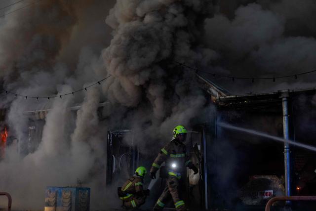 Ukrainian rescuers work at the site of a Russian strike in Kyiv on August 16, 2026, amid the Russian invasion of Ukraine. Russian strikes killed one person and wounded at least seven others in Ukraine, authorities said August 16, while Moscow officials reported downing more than 100 drones heading towards the capital. (Photo by Tetiana DZHAFAROVA / AFP)