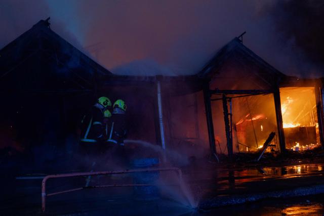 Ukrainian rescuers work at the site of a Russian strike in Kyiv on August 16, 2026, amid the Russian invasion of Ukraine. Russian strikes killed one person and wounded at least seven others in Ukraine, authorities said August 16, while Moscow officials reported downing more than 100 drones heading towards the capital. (Photo by Tetiana DZHAFAROVA / AFP)