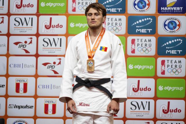 Moldavia's Vlad Mitru poses with his gold medal in the men's -73kg category final event, during the International Judo Federation (IJF) Lima Grand Prix 2026, in Lima, on August 15, 2026. (Photo by ERNESTO BENAVIDES / AFP)