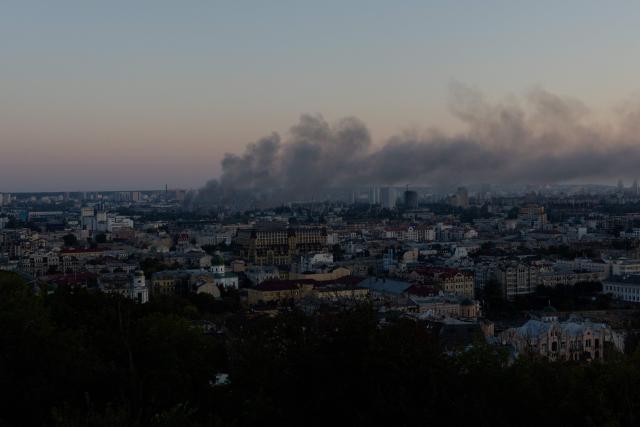 Smoke rises over the city following a Russian strike in Kyiv on August 16, 2026, amid the Russian invasion of Ukraine. Russian strikes killed one person and wounded at least seven others in Ukraine, authorities said August 16, while Moscow officials reported downing more than 100 drones heading towards the capital. (Photo by Tetiana DZHAFAROVA / AFP)