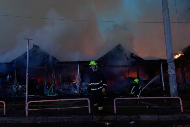 Ukrainian rescuers work at the site of a Russian strike in Kyiv on August 16, 2026, amid the Russian invasion of Ukraine. Russian strikes killed one person and wounded at least seven others in Ukraine, authorities said August 16, while Moscow officials reported downing more than 100 drones heading towards the capital. (Photo by Tetiana DZHAFAROVA / AFP)