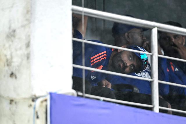 India's Ravindra Jadeja waits inside the dressing room as rain delays the start of play on second day of the first Test cricket match between Sri Lanka and India at the Galle International Stadium in Galle on August 16, 2026. (Photo by Ishara S. KODIKARA / AFP)