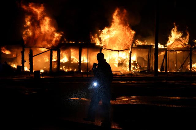 A Ukrainian rescuer works at the site of a Russian strike in Kyiv on August 16, 2026, amid the Russian invasion of Ukraine. Russian strikes killed one person and wounded at least seven others in Ukraine, authorities said August 16, while Moscow officials reported downing more than 100 drones heading towards the capital. (Photo by AFP)
