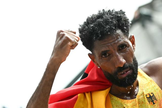 Gold medallist Germany's Amanal Petros celebrates after winning the men's marathon during the European Athletics Championships in Birmingham on August 16, 2026. (Photo by Paul ELLIS / AFP)