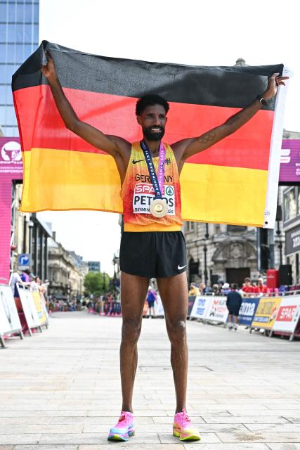 Gold medallist Germany's Amanal Petros celebrates after winning the men's marathon during the European Athletics Championships in Birmingham on August 16, 2026. (Photo by Paul ELLIS / AFP)