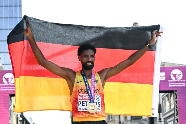 Gold medallist Germany's Amanal Petros celebrates after winning the men's marathon during the European Athletics Championships in Birmingham on August 16, 2026. (Photo by Paul ELLIS / AFP)