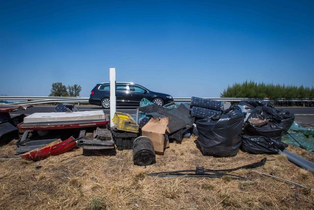 The accident site of an overturned Polish tourist bus is pictured on the M3 motorway in Szentendre near Mezokeresztes, about 150 km east of the Hungarian capital Budapest, on August 16, 2026. A Polish bus overturned on a Hungarian highway early Sunday, August 16, 2026, killing 12 people and leaving at least 10 with serious injuries, Hungary's Prime Minister Peter Magyar and officials said. The coach, heading from Serbia to Poland, crashed at 1:00 am (2300 GMT Saturday) on the M3 highway near Mezokeresztes, east of Budapest, according to a police statement. (Photo by FERENC ISZA / AFP)
