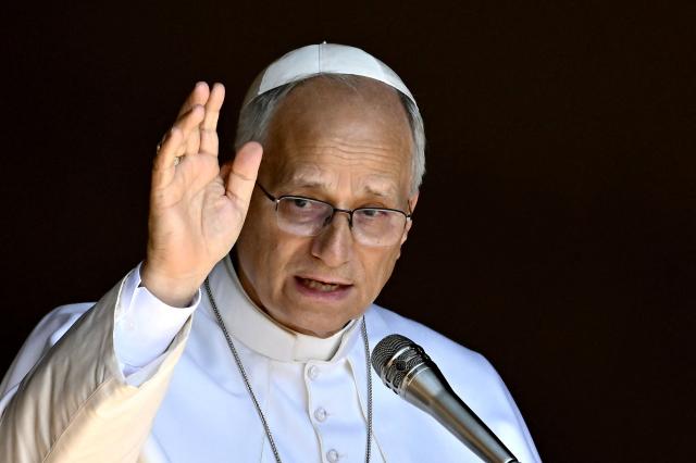 Pope Leo XIV delivers his blessing to the faithful gathered in Piazza della Libertà in front of the Apostolic Palace during the Angelus prayer in Castel Gandolfo on August 16, 2026. (Photo by Filippo MONTEFORTE / AFP)