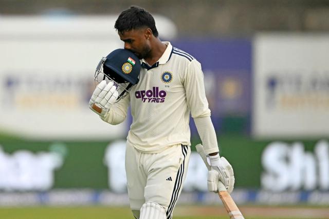 India's Manav Suthar walks back to the pavilion after his dismissal during the second day of the first Test cricket match between Sri Lanka and India at the Galle International Stadium in Galle on August 16, 2026. (Photo by Ishara S. KODIKARA / AFP)