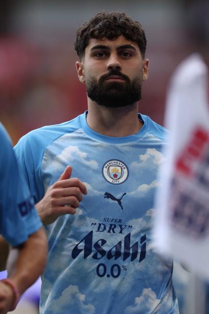 Manchester City's Croatian defender #24 Josko Gvardiol warms up ahead of the English FA Community Shield football match between Arsenal and Manchester City at The Principality Stadium, in Cardiff, south Wales on August 16, 2026. (Photo by Adrian Dennis / AFP)