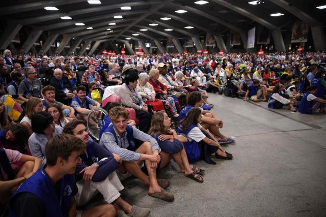 Faithful attend Mass in the underground Basilica of St. Pius X at the Lourdes sanctuary, southwestern France, on August 16, 2026. (Photo by Valentine CHAPUIS / AFP)