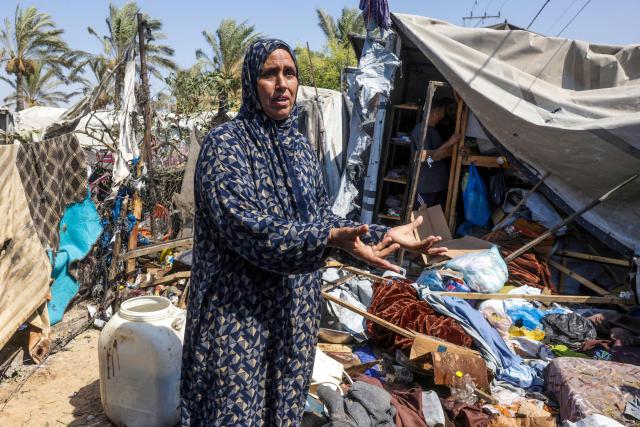 A displaced Palestinian woman inspects the damage at the site of an alleged Israeli strike on a tent in Khan Yunis, in the southern Gaza Strip, on August 16, 2026. US President Donald Trump's envoy and son-in-law Jared Kushner discussed Trump's Gaza plan with Egyptian President Abdel Fattah al-Sisi on August 16, hours after Hamas chief Khalil El-Hayya met with Egypt's spy chief. Kushner is set to travel next to Israel, which has publicly rejected a 15-point plan in which Hamas agreed to hand over its weapons to a new Palestinian governing committee in Gaza. (Photo by Bashar Taleb / AFP)