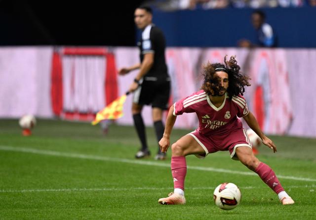 Real Madrid's Spanish defender #17 Marc Cucurella plays the ball during the pre-season friendly football match between FC Schalke 04 and Real Madrid in Gelsenkirchen, western Germany, on August 16, 2026. (Photo by INA FASSBENDER / AFP)