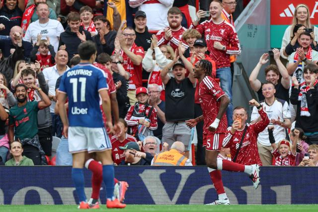 Liverpool's French defender #05 Jeremy Jacquet (R) celebrates after scoring his team's second goal during the pre-season friendly football match between Liverpool and Como at Anfield in Liverpool, north west England on August 16, 2026. (Photo by Darren Staples / AFP)