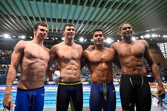 (LtoR) France's Leon Marchand, France's Maxime Grousset, France's Carl Aitkaci and France's Yohann Ndoye-Brouard celebrate winning the bronze medal after the final of the men's 4x100m medley relay swimming event during the LEN European Aquatics Championships at the Olympic Aquatic Centre in Saint-Denis, northern suburbs of Paris, on August 16, 2026. (Photo by JULIEN DE ROSA / AFP)