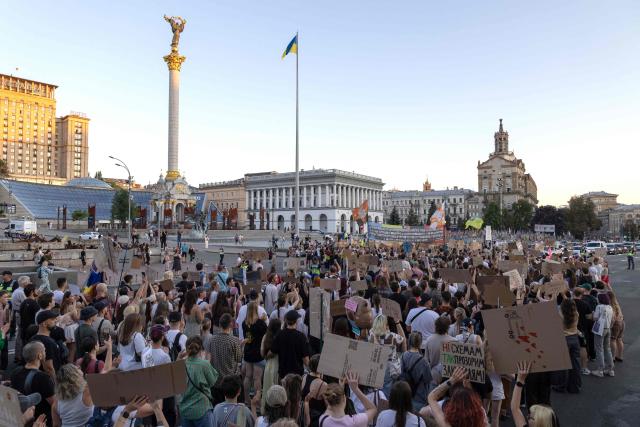 Protesters carry placards as they march during a rally calling for a reform of the defence sector and the reinstatement of the young and tech-savvy defence minister Mykhailo Fedorov, who was sacked a mounth ago, in central Kyiv on August 16, 2026, amid the Russian invasion of Ukraine. Fedorov, 35, was appointed in January on a mandate to modernise and digitise the Ukrainian military but was removed after months of behind-the-scenes clashes with the army command, who he said resisted his calls to change. His removal triggered a wave of protests that pushed President Volodymyr Zelensky to also replace army’s commander Oleksandr Syrsky, seen as Fedorov’s rival. (Photo by Serhii Okunev / AFP)
