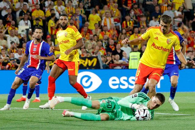 Lens' French goalkeeper #40 Robin Risser catches the ball during the French Super Cup (Trophee des Champions) football match between RC Lens and Paris Saint-Germain (PSG) at the Stade Bollaert-Delelis in Lens, northern France on August 16, 2026. (Photo by GEOFFROY VAN DER HASSELT / AFP)