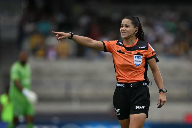 Mexican referee Karen Hernandez Andrade gestures during the Liga MX Apertura tournament football match between Pumas and Queretaro at the Olimpico Universitario stadium in Mexico City, on August 16, 2026. (Photo by CARL DE SOUZA / AFP)