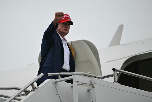 US President Donald Trump boards Air Force One at Morristown Municipal Airport in Morristown, New Jersey, on August 16, 2026. President Trump is travelling back to Washington, DC, after spending the weekend at his golf club in New Jersey. (Photo by Kent NISHIMURA / AFP)