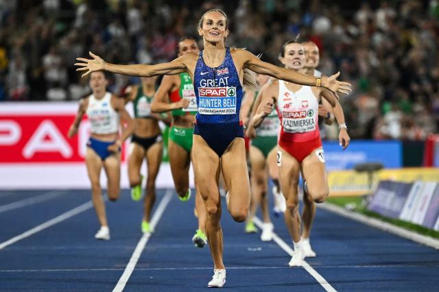 Britain's Georgia Hunter Bell celebrates as she crosses the finish line to win the women's 1500m final during the European Athletics Championships at Alexander Stadium in Birmingham on August 16, 2026. (Photo by Paul ELLIS / AFP)