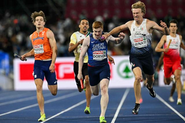 Italy's Lorenzo Benati (R) celebrates as he crosses the finish line, past Britain's Charles Dobson, to win the men's 4 x 400m relay final during the European Athletics Championships at Alexander Stadium in Birmingham on August 16, 2026. (Photo by Paul ELLIS / AFP)