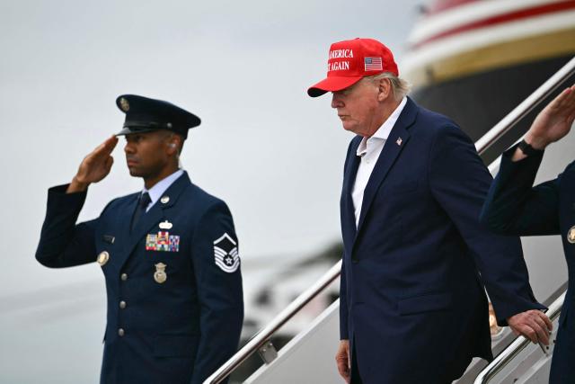 US President Donald Trump steps off Air Force One upon arrival at Joint Base Andrews in Maryland on August 16, 2026. President Trump is returning to Washington, DC, after spending the weekend at his golf club in New Jersey. (Photo by Kent NISHIMURA / AFP)