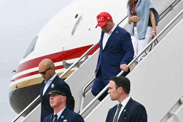 Bill Pulte (C, in red hat), director of the US Federal Housing Finance Agency, steps off Air Force One upon arrival at Joint Base Andrews in Maryland on August 16, 2026. President Trump is returning to Washington, DC, after spending the weekend at his golf club in New Jersey. (Photo by Kent NISHIMURA / AFP)