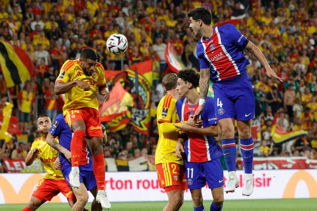 Lens' French defender #14 Matthieu Udol (C-L) heads the ball during the French Super Cup (Trophee des Champions) football match between RC Lens and Paris Saint-Germain (PSG) at the Stade Bollaert-Delelis in Lens, northern France on August 16, 2026. (Photo by GEOFFROY VAN DER HASSELT / AFP)
