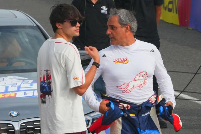 Former Colombian Formula 1 driver Juan Pablo Montoya and his son Sebastian attend a racing event, which profit will be donated to the recent 7.4 earthquake victims, on a street circuit in Barranquilla, Colombia on August 16, 2026. At least 287 people have died, thousands have been injured and about 379 remain unaccounted for, as the chances of finding earthquake survivors have dropped sharply since the critical 72-hour window passed, though volunteers and rescue crews continue digging through the rubble for any signs of life. (Photo by Vanexa Romero / AFP)
