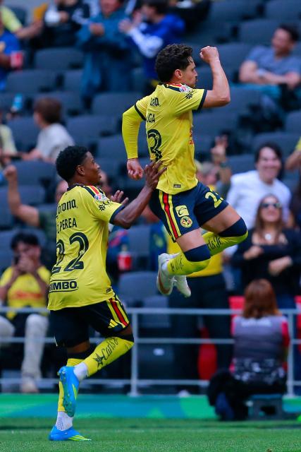 America's Brazilian midfielder #23 Raphael Veiga celebrates scoring his team's first goal during the Liga MX Apertura tournament football match between America and San Luis at the Banorte stadium in Mexico City, on August 16, 2026. (Photo by AFP)
