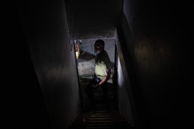 A man inspects his damaged house after a 7.4 earthquake in Quibdo, Colombia on August 16, 2026. At least 287 people have died, thousands have been injured and about 379 remain unaccounted for, as the chances of finding earthquake survivors have dropped sharply since the critical 72-hour window passed, though volunteers and rescue crews continue digging through the rubble for any signs of life. (Photo by ESTEBAN VEGA LA-ROTTA / AFP)