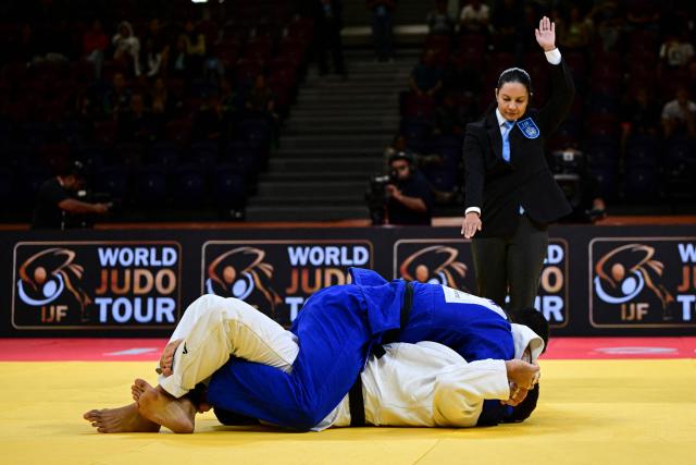 Cyprus' Giannis Antoniou (blue) competes for gold against Croatia's Mikita Sviryd in the men's +100kg category final event, during the International Judo Federation (IJF) Lima Grand Prix 2026, in Lima, on August 16, 2026. (Photo by Ernesto BENAVIDES / AFP)