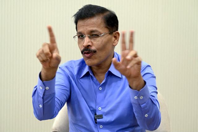 This photograph taken on July 30, 2026 shows Maharashtra's Commissioner of the Food and Drug Administration (FDA), Tukaram Mundhe speaking with AFP at his office in Mumbai. When food safety inspectors raided a Mumbai dessert parlour famed for its ice cream sandwiches last month, they found rats, houseflies and expired flavouring agents. At another beloved restaurant known for slow-cooked mutton and beef stews, they discovered meat stored in filthy containers, greasy floors and open windows that could let in insects and crows. Both eateries were ordered shut in the toughest crackdown in years on restaurants in the megacity of more than 20 million people. The sweep has targeted everything from top eateries and luxury hotels to canteens at elite institutions, including the nearly century-old Cricket Club of India. (Photo by Indranil MUKHERJEE / AFP)