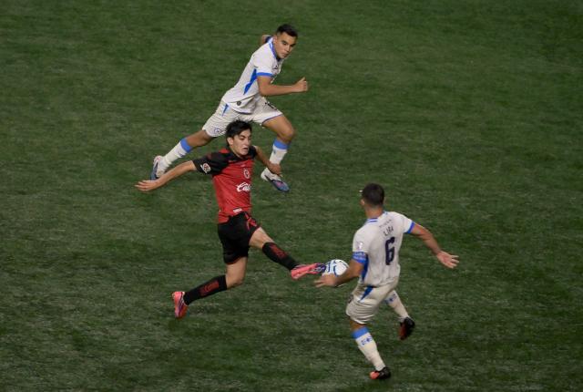 Tijuana's midfielder #10 Gilberto Mora and Cruz Azul's midfielder #06 Erik Lira fight for the ball during the Liga MX Apertura football match between Tijuana and Cruz Azul at Caliente stadium in Tijuana, Mexico on August 16, 2026. (Photo by Guillermo Arias / AFP)