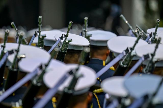 The muzzles of soldiers' weapons are seen during a flag raising ceremony marking Indonesia's 81st Independence Day at Merdeka Palace in Jakarta on August 17, 2026. (Photo by BAY ISMOYO / AFP)