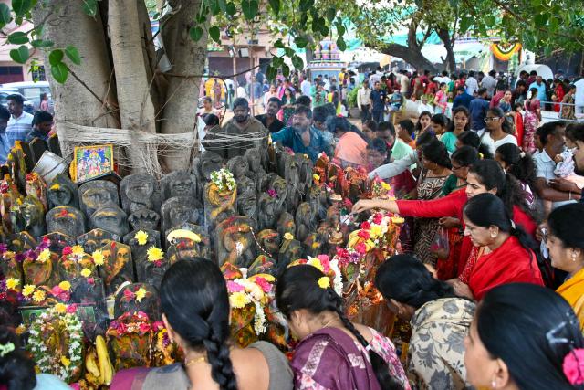 Devotees worship the Hindu mythical serpent idols during the Naga Panchami festival in Hyderabad on August 17, 2026. (Photo by Noah SEELAM / AFP)