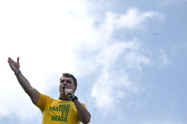 Brazil’s right-wing presidential candidate and senator Flavio Bolsonaro speaks to supporters during a campaign rally at Copacabana Beach in Rio de Janeiro, Brazil, on August 16, 2026. Brazilians will go to the polls next October 4 once again deeply polarized and under the shadow of US President Donald Trump, who has backed conservative candidates in recent elections in Latin America. (Photo by MAURO PIMENTEL / AFP)