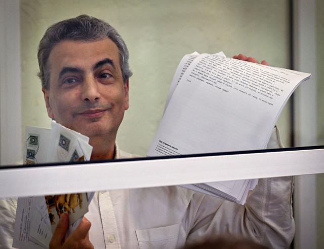 Russian opposition politician Lev Shlosberg reacts as he attends a city court session in Pskov, northwestern Russia on August 17, 2026, before being sentenced to 11 years in prison over his criticism of Moscow's offensive in Ukraine. The veteran Yabloko party member was found guilty of "public actions aimed at discrediting the use of the Armed Forces of the Russian Federation". (Photo by Olga MALTSEVA / AFP)