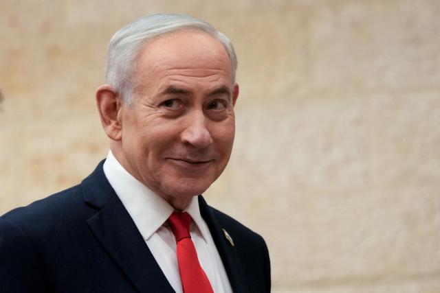 TOPSHOT - Israeli Prime Minister Benjamin Netanyahu arrives to cast his ballot at his party Likud's main polling station during primary elections ahead of Israels general election in October in Jerusalem on August 17, 2026. The Likud, the historic party of the Israeli right and the political base of Prime Minister Benjamin Netanyahu, held primaries on August 17 to determine its slate of candidates for the general election on October 27. Likud is projected to win around 22-23 of the 120 seats in the Knesset, Israel's parliament, according to the latest polls -- a dramatic drop from the 32 seats it won in the 2022 election. (Photo by Ohad Zwigenberg / POOL / AFP)