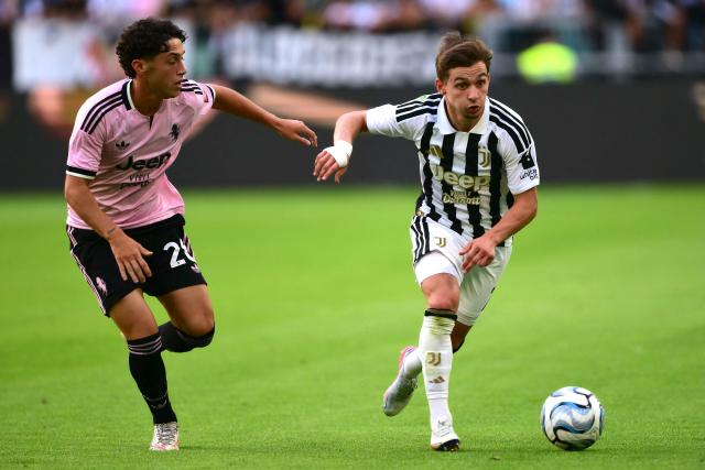 Juventus' Portuguese forward #07 Francisco Conceicao (R) fights for the ball with Next Gen's Belgian midfielder #20 Enzo Keutgen during the friendly football match between Juventus and Juventus Next Gen at the Allianz Stadium in Turin, on August 17, 2026. (Photo by Marco Bertorello / AFP)