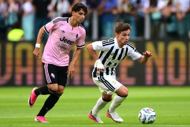 Next Gen's Italian defender #02 Niccolo Rizzo (L) fights for the ball with Juventus' Portuguese forward #07 Francisco Conceicao  during the friendly football match between Juventus and Juventus Next Gen at the Allianz Stadium in Turin, on August 17, 2026. (Photo by Marco Bertorello / AFP)