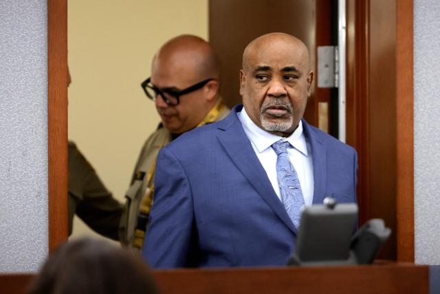 Duane Davis arrives for the opening statements of his murder trial, related to the 1996 killing of rapper Tupac Shakur, at Clark County District Court in the Regional Justice Center in Las Vegas, Nevada, on August 17, 2026. The trial of the former gang leader accused of orchestrating the murder of rapper Tupac Shakur began on August 10, 30 years after one of America's most high-profile unresolved killings. The proceedings, expected to last a month, will likely not make clear who fired the shots that killed the California hip-hop legend on the night of September 7, 1996, while he was in Las Vegas to see a Mike Tyson boxing match. (Photo by STEVE MARCUS / POOL / AFP)