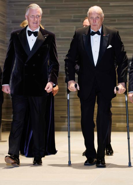 (FILES) King Philippe - Filip of Belgium (L) and King Harald V of Norway walk ahead of a concert at the National Museum in Oslo, on the second day of the official state visit of the Belgian royal couple to Norway, on March 25, 2026. Norway's 89-year-old King Harald was hospitalised on August 17, 2026 and put on sick leave for two weeks, the royal palace announced. (Photo by BENOIT DOPPAGNE / Belga / AFP) / Belgium OUT