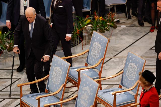 (FILES) Norway's King Harald V (L) and Norway's Queen Sonja (R) arrive for the Nobel Peace Prize ceremony at Oslo City Hall on December 10, 2025 in Oslo, Norway. Norway's 89-year-old King Harald was hospitalised on August 17, 2026 and put on sick leave for two weeks, the royal palace announced. (Photo by Odd ANDERSEN / AFP)